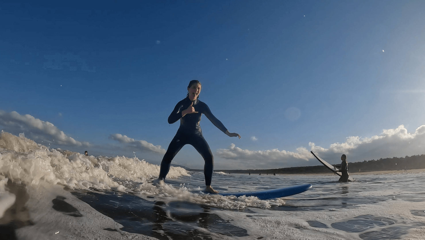 Group traveller surfing at surf camp in Australia