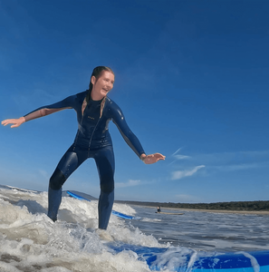 Group traveller surfing at surf camp in Australia
