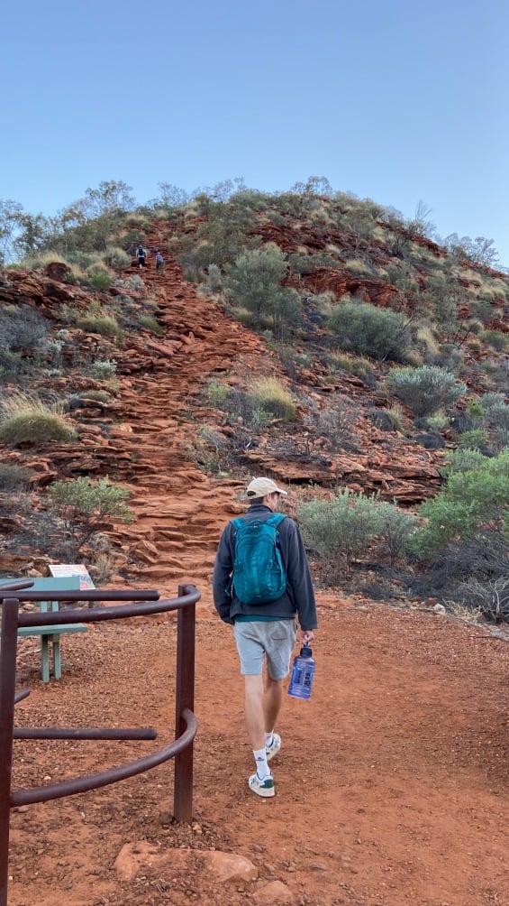 Man walking along the trail around Uluru