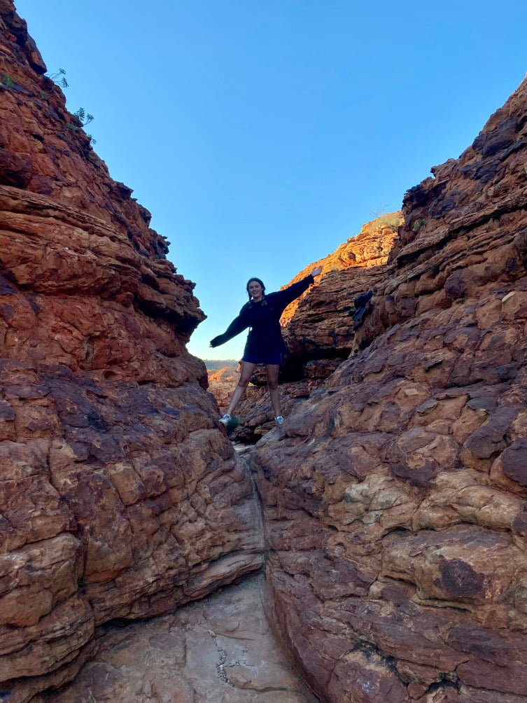 Customer climbing the rocks on trail
