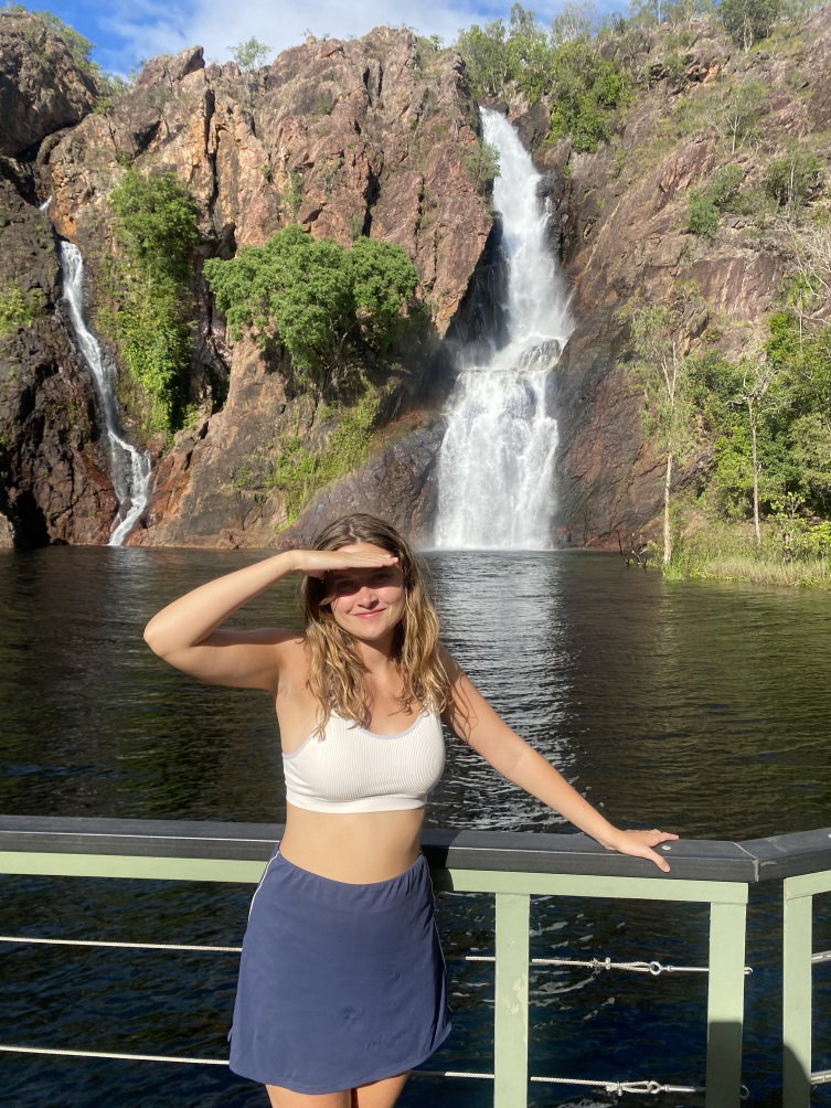 Customer stood in front of waterfall in Litchfield National Park