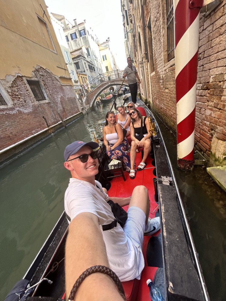 group of travellers on gondola taking a selfie