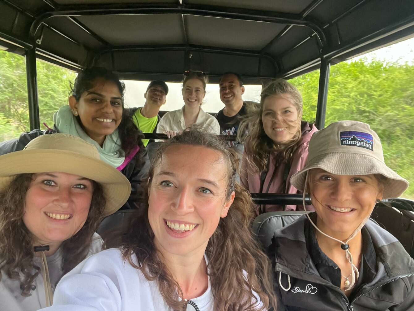 Group of travellers in safari truck in south africa