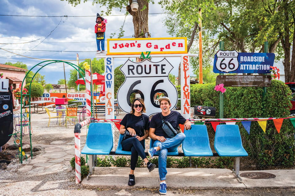 Couple sit on a bench on Route 66