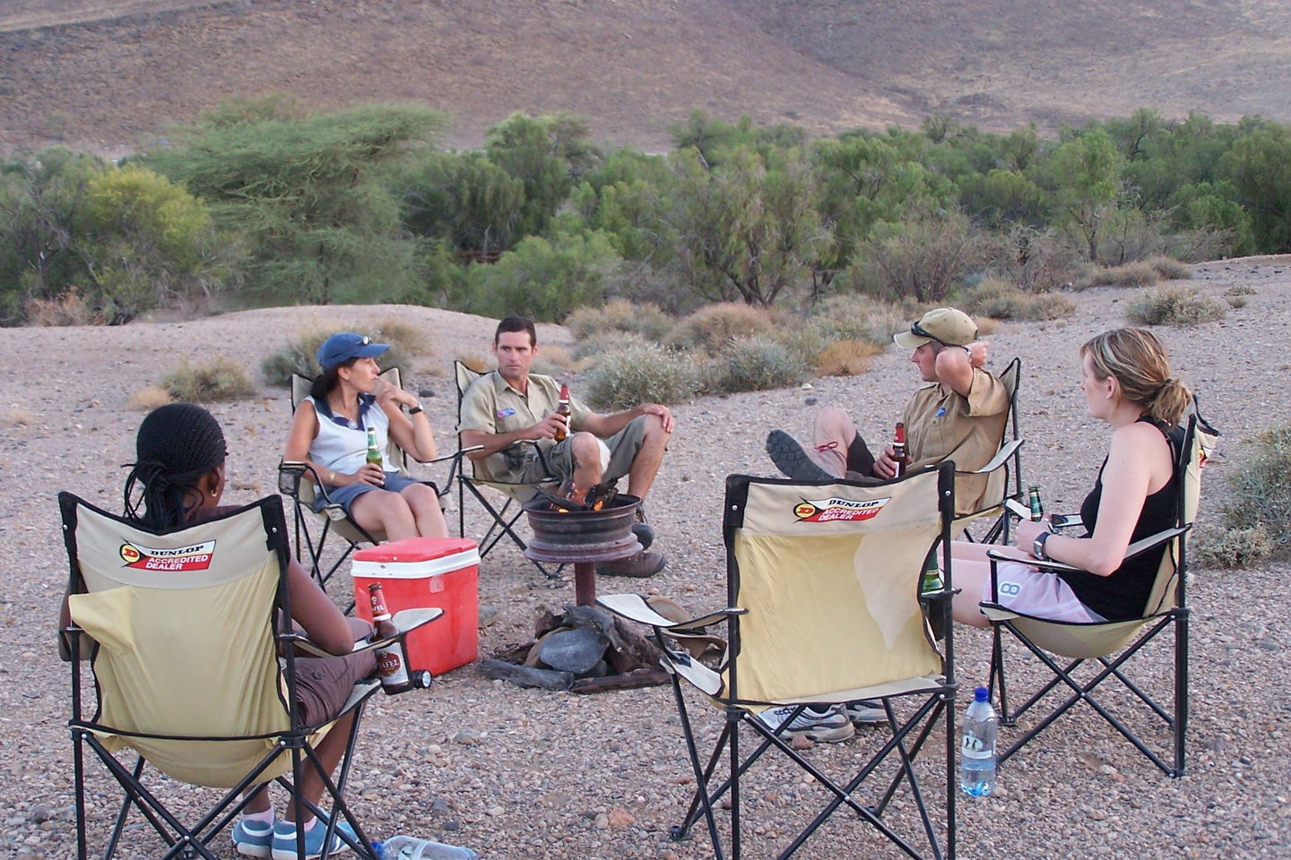 Group of travellers camping in the dessert.