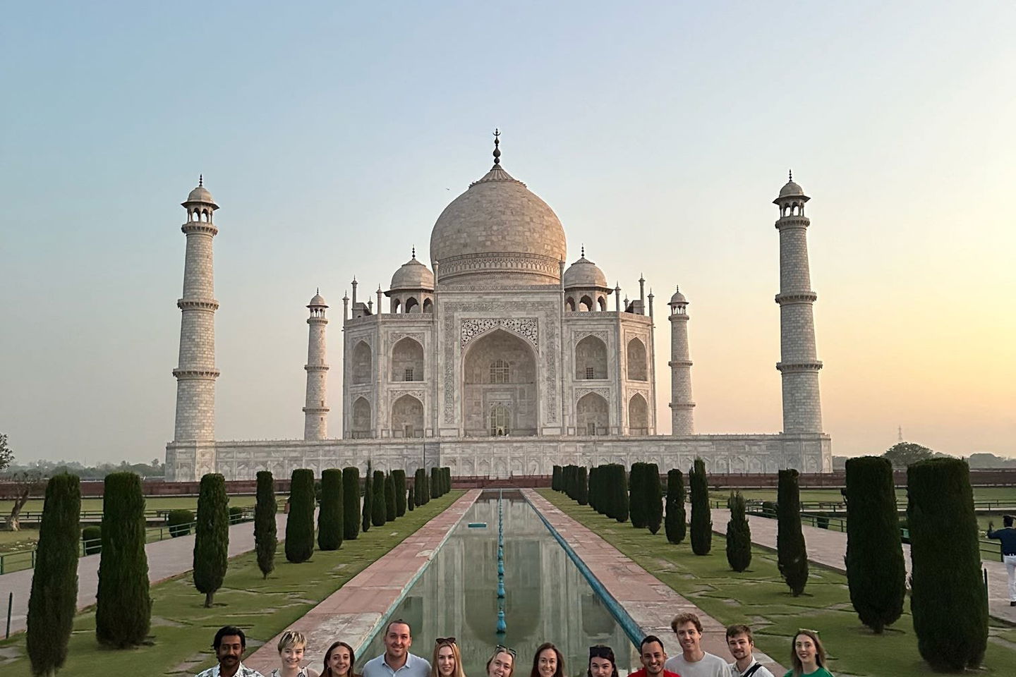 Group of travellers in front of the Taj Mahal in India