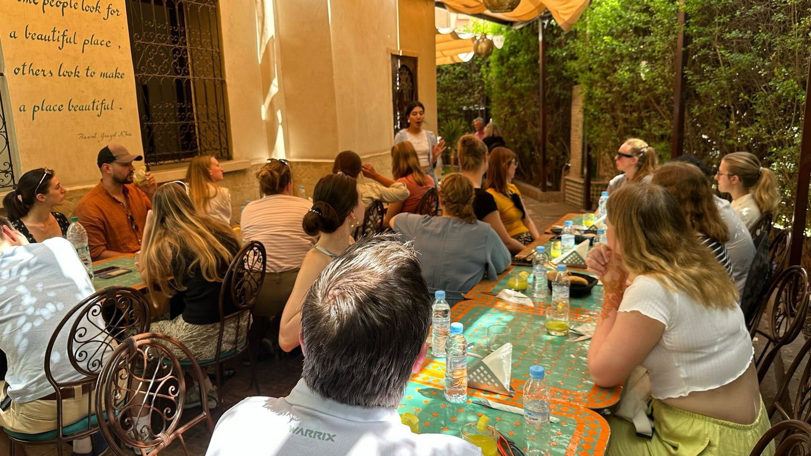 Morocco women talking and teaching to group tour 
