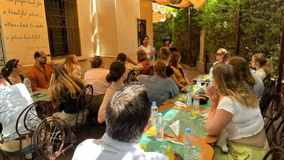 Morocco women talking and teaching to group tour 