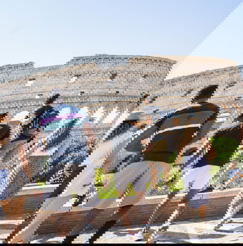 Group travellers at the colosseum in italy rome