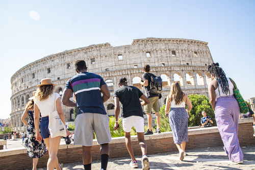 Group travellers at the colosseum in italy rome
