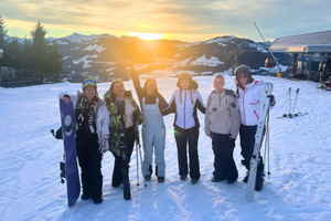 Group of travellers on the mountain at sunset