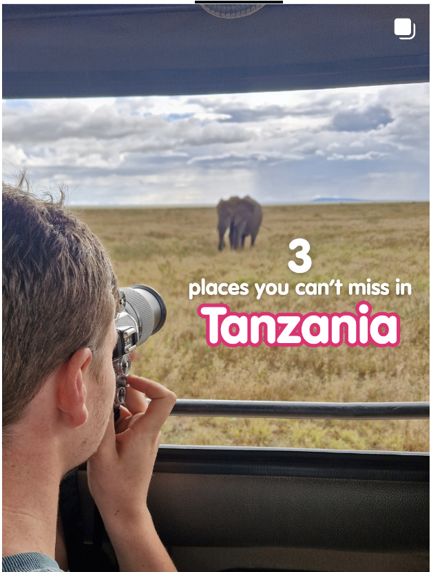 Traveller in Serengeti National Park taking a photo of an elephant in Tanzania. 3 places you can't miss in Tanzania