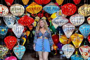 Traveller posing by lanterns in Vietnam