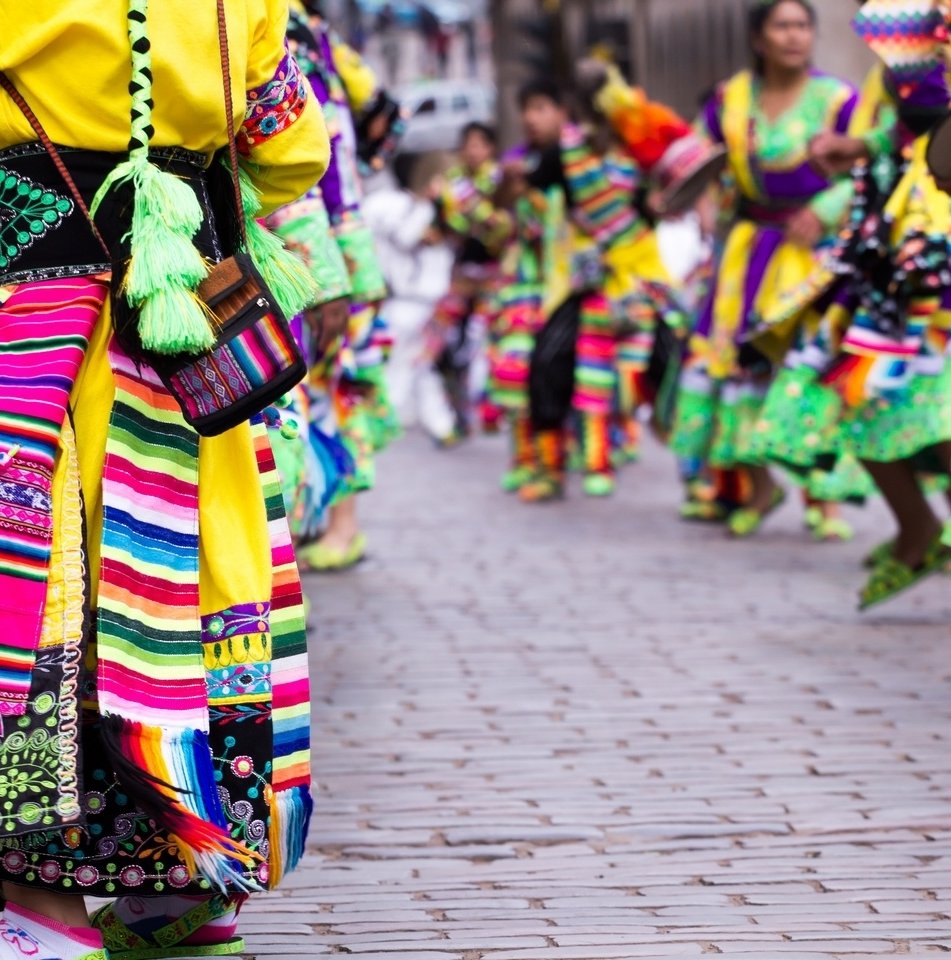 Colourful traditional dress and dancers in the streets