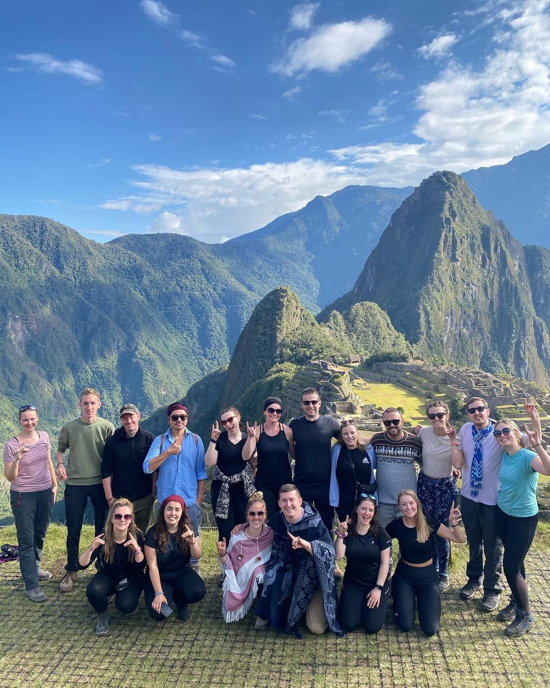 Group travellers in peru at machu picchu