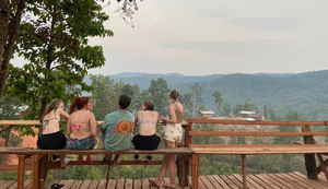 Group of travellers looking out in rural Chiang Mai, Thailand