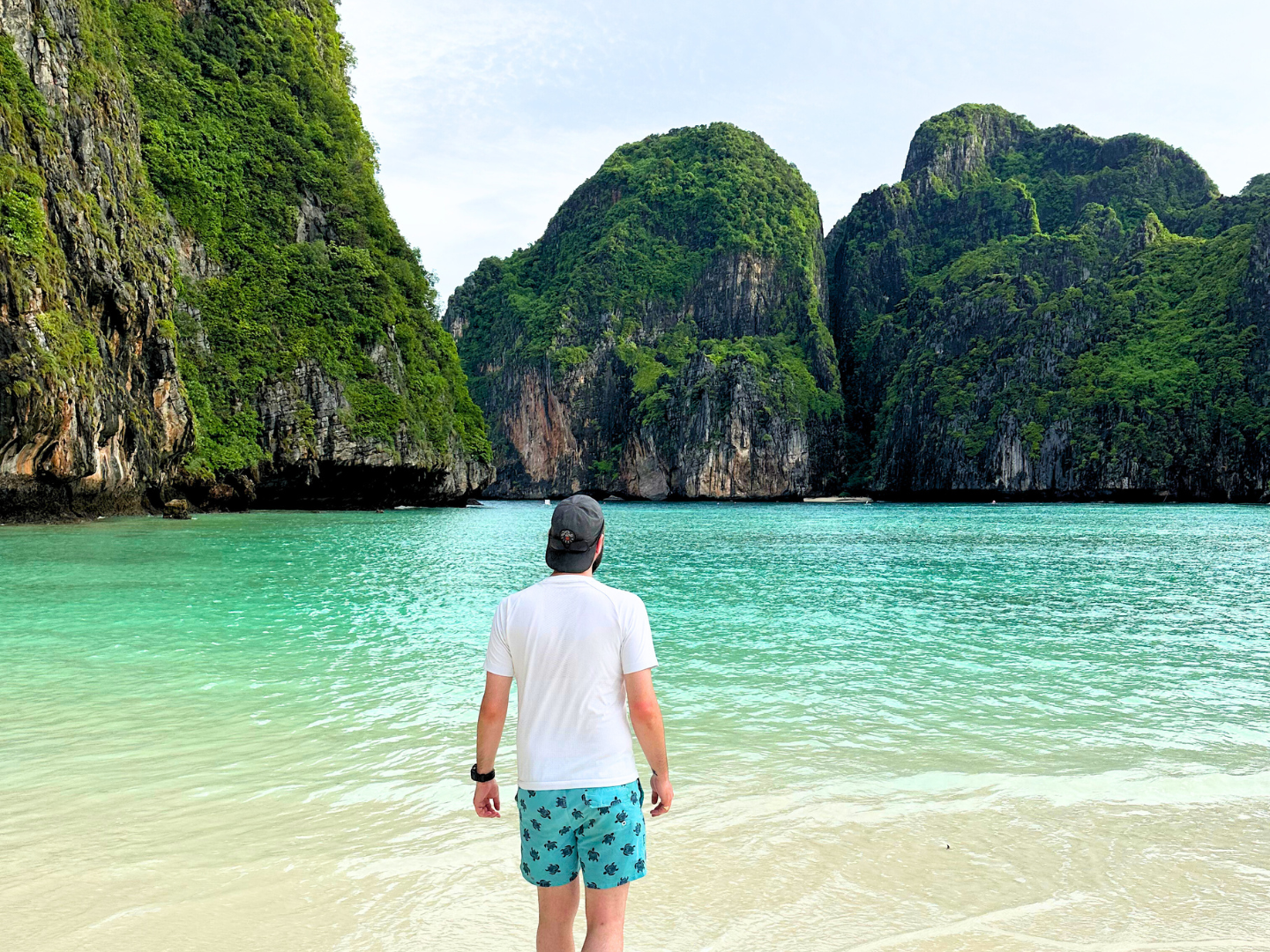 Male group traveller looking over Maya Bay