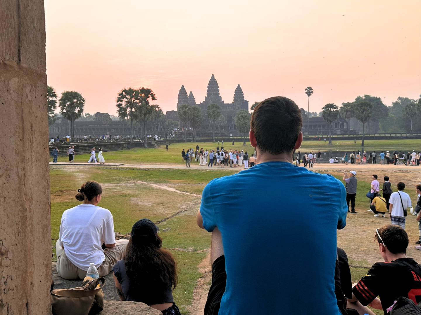 Male group traveller looking over Angkor Wat in Cambodia