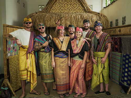 A group of travellers in traditional Indonesian clothing