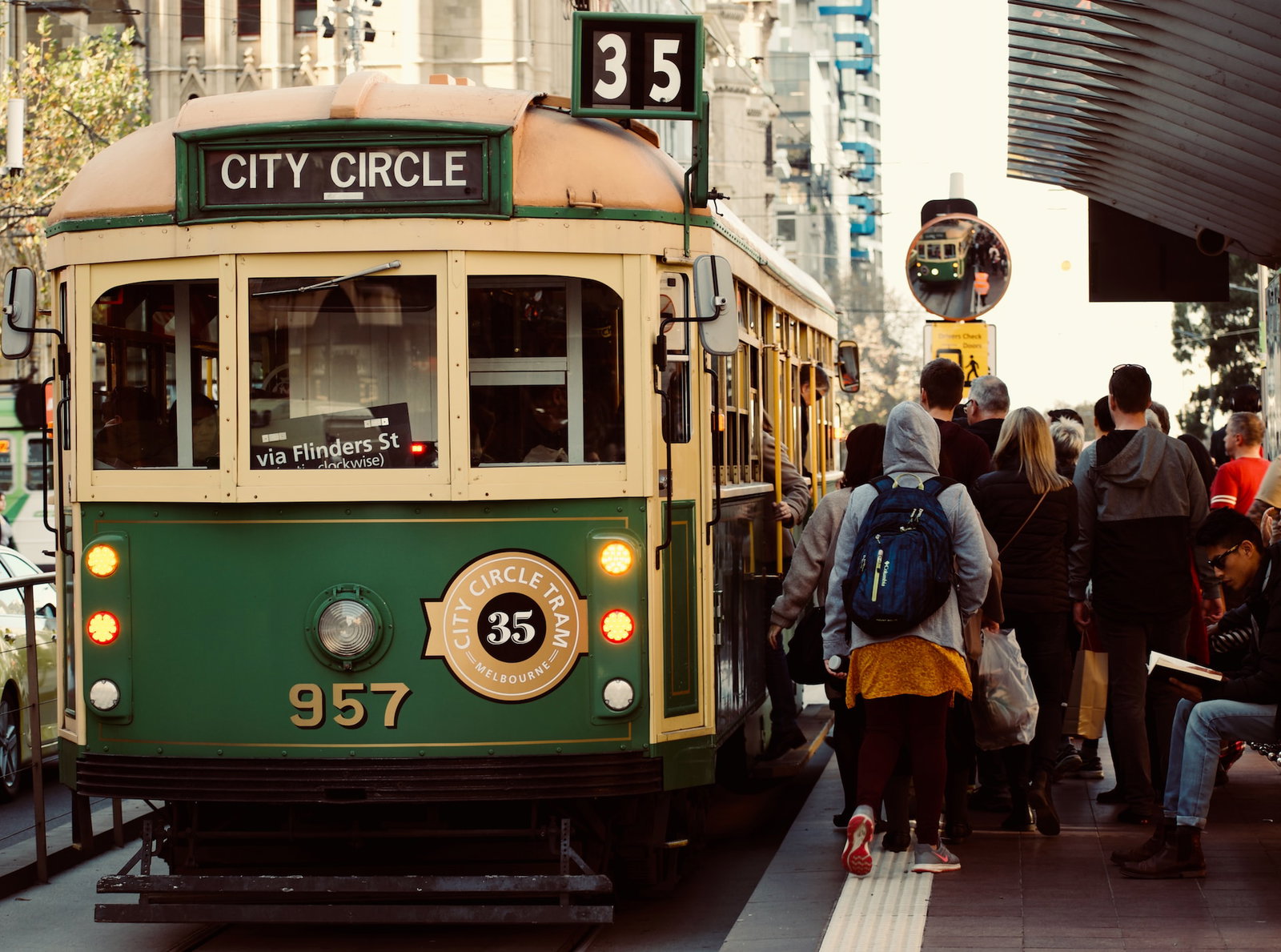People waiting too board an old tram in Melbourne