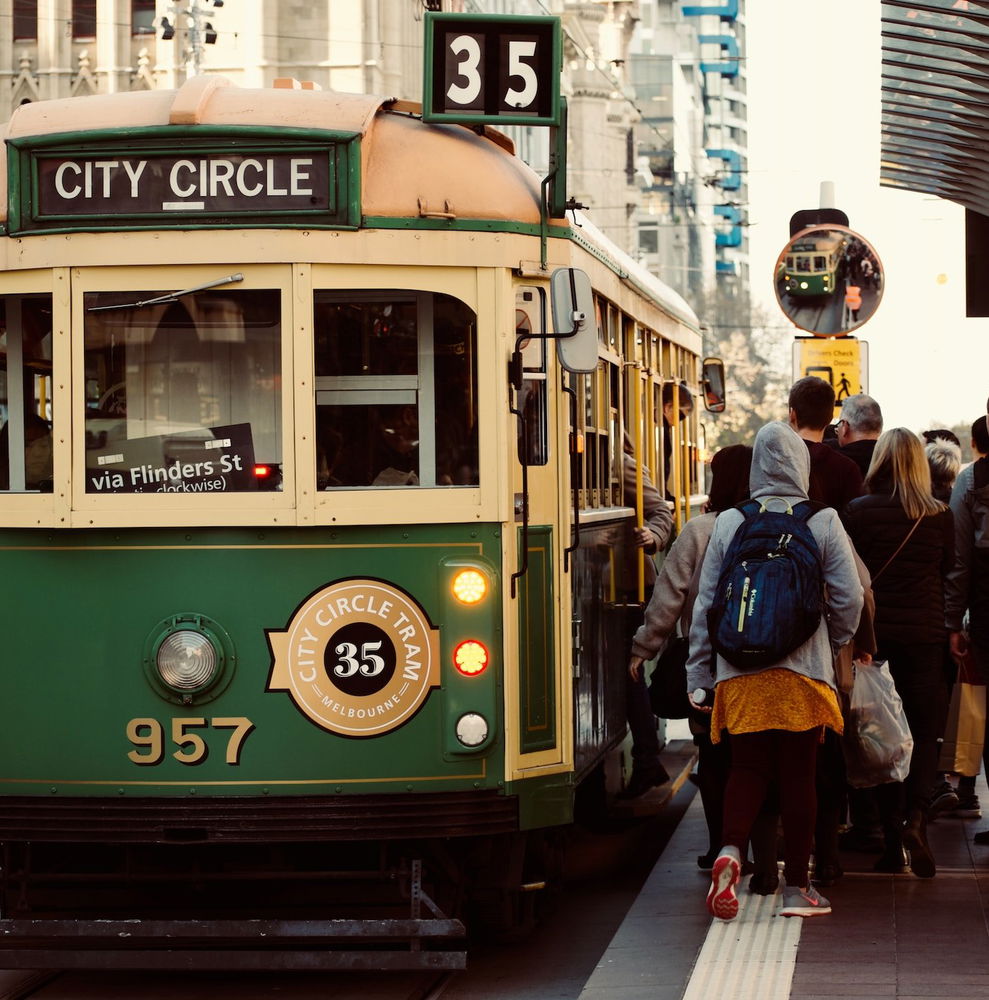People waiting too board an old tram in Melbourne