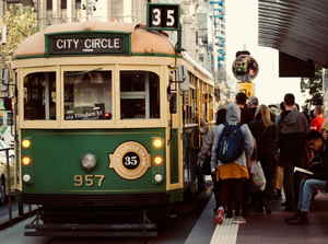 People waiting too board an old tram in Melbourne