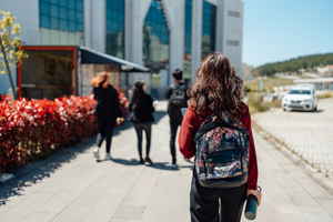 Person walking in front of school building 