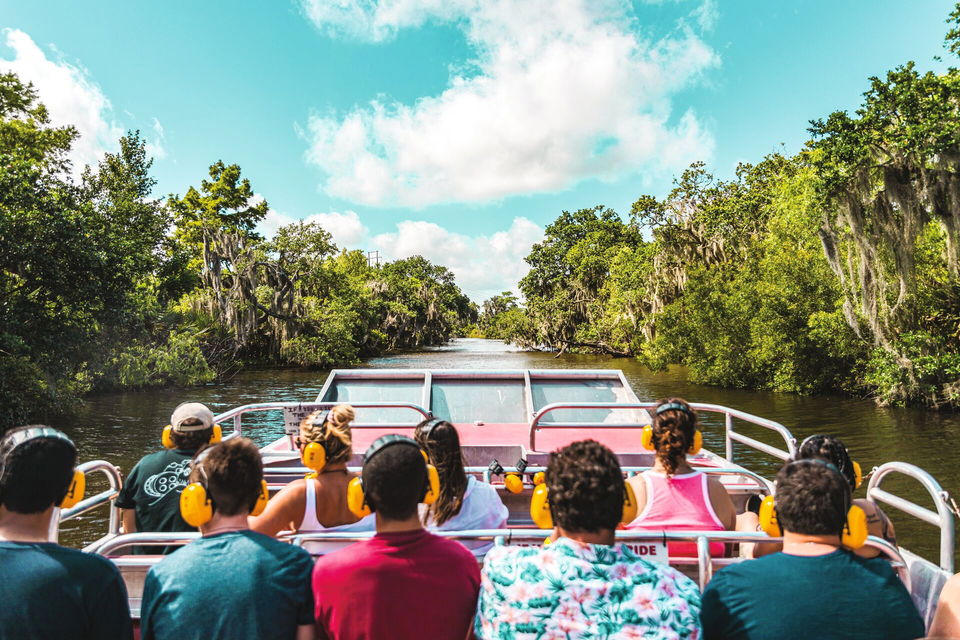 Group of travellers on swamp tour boat in New Orleans