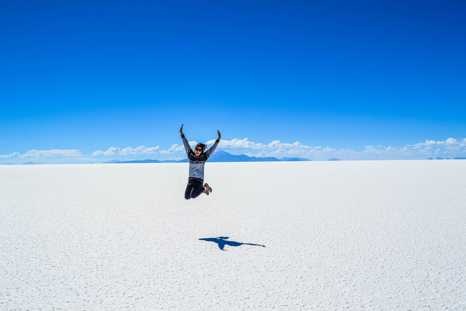 Girl jumping in the air on the Salt Flats in Bolivia