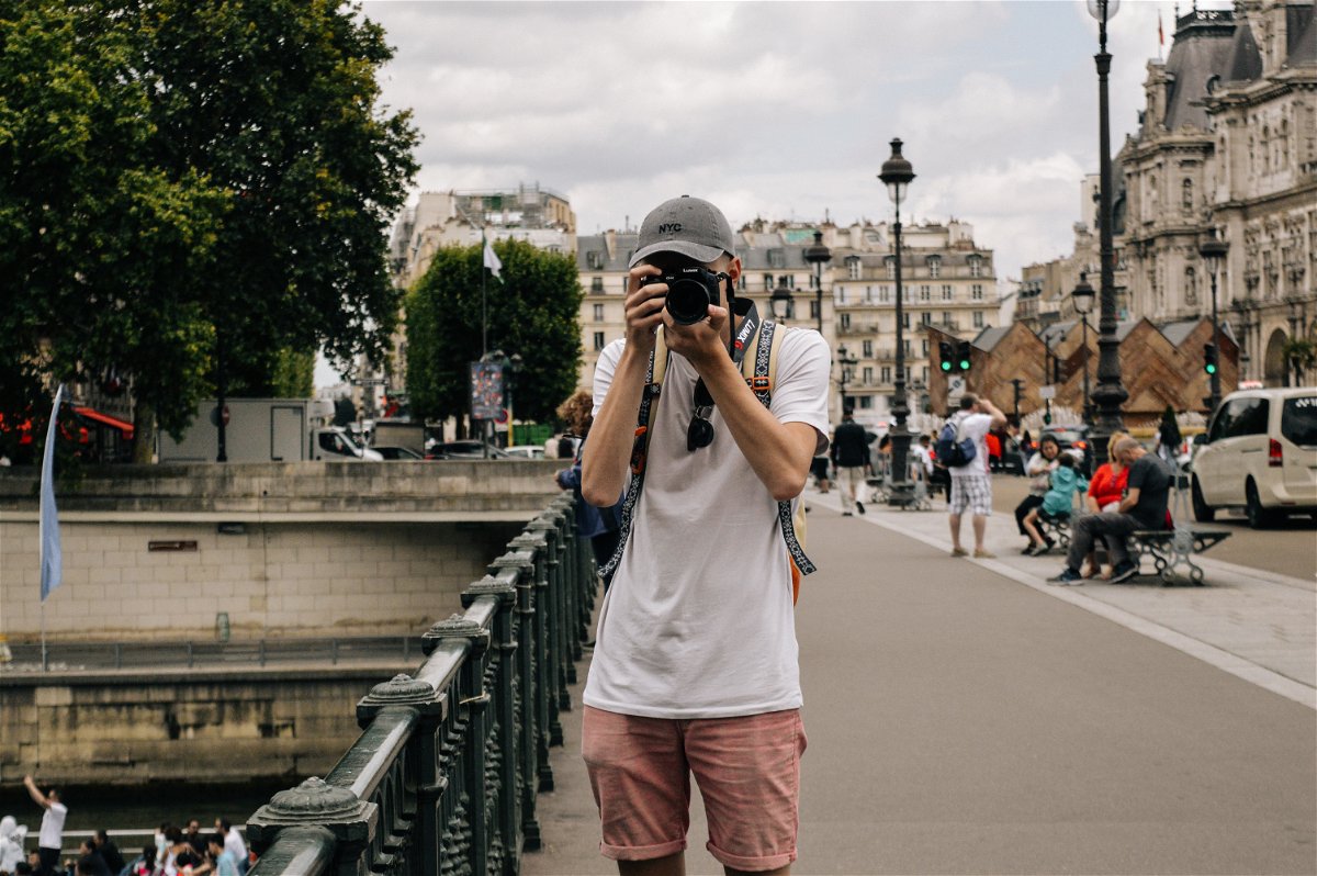 Person taking a photo in Paris, France