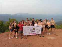 Group in rural Chiang Mai with Gap 360 flag 