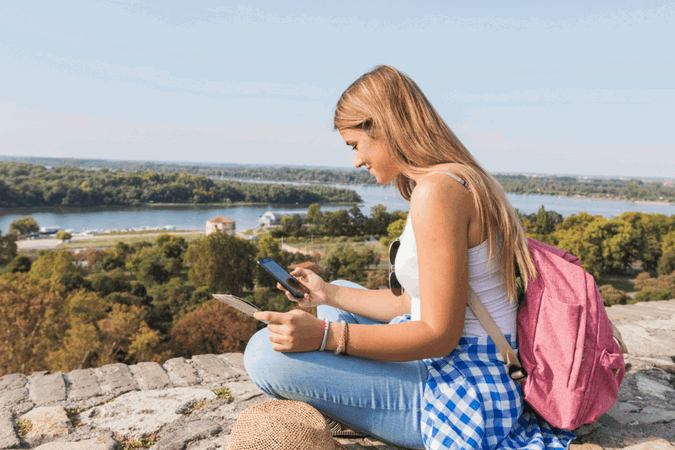 Group traveller on phone calling emergency phone number