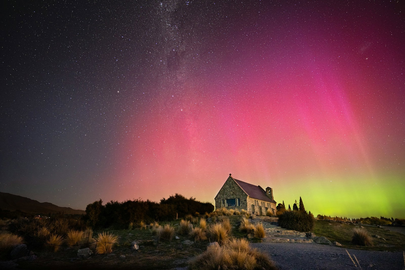 Southern Lights over a scenic church in Lake Tekapo