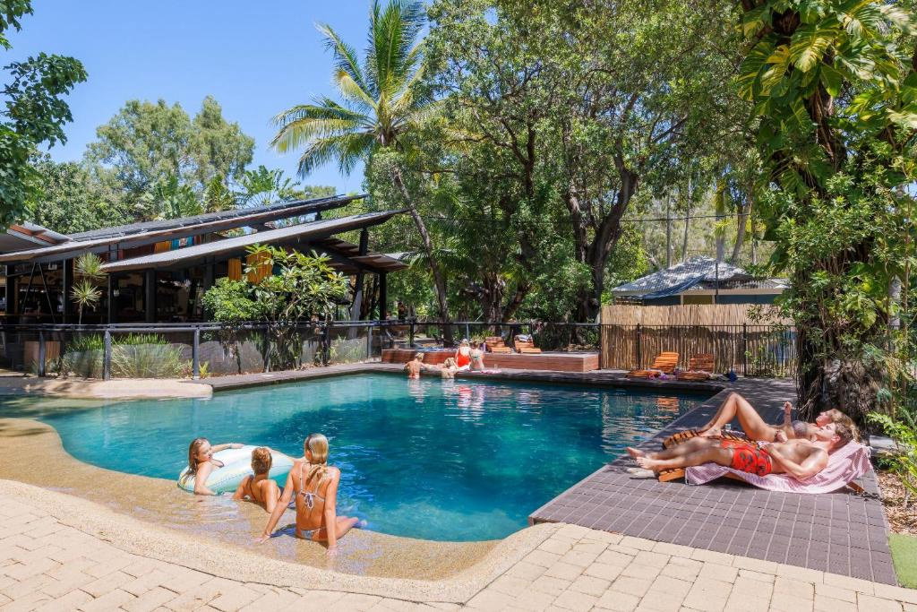Group travellers in pool at hostel at Magnetic Island Australia