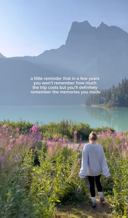 Female traveller running near lake in Canada