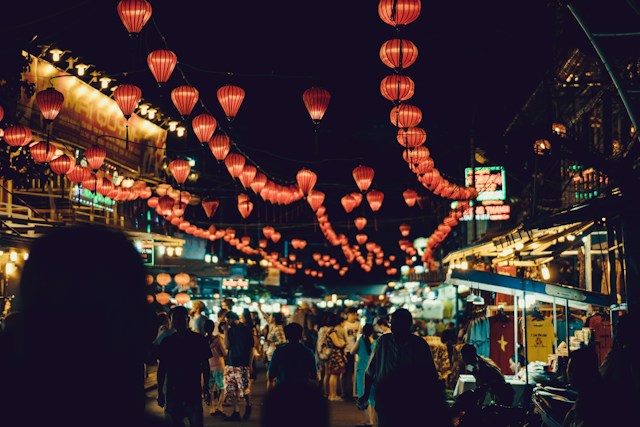Market stalls at night lined with red lanterns in Phu Quoc, Vietnam
