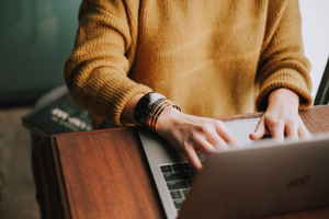 Woman using a laptop at a desk
