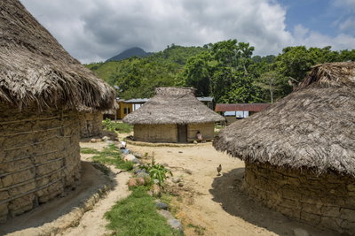 Traditional straw-roofed huts in a Cambodian village