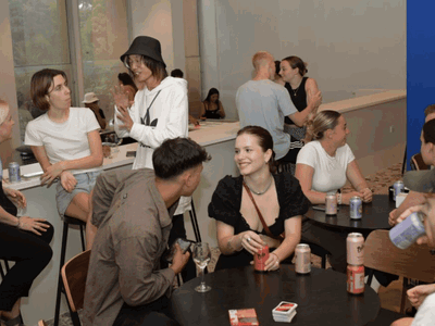 Group of travellers in communal in hostel in Melbourne