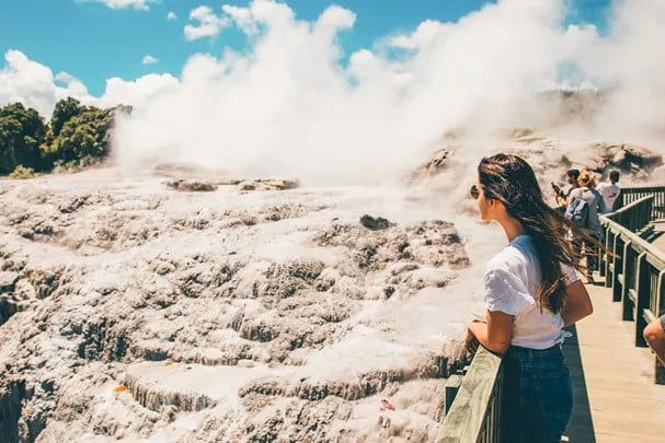 Girl looking at the thermal pools at Rotorua