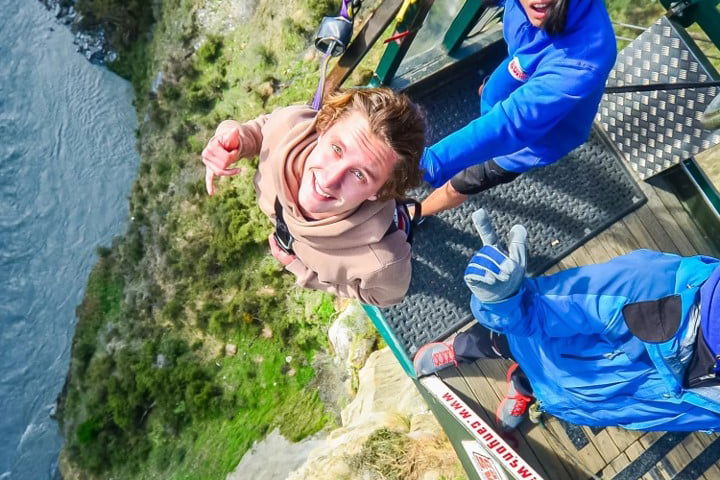 Group standing on top of the canyon swing
