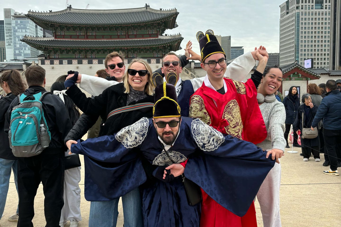 Travellers in traditional clothing gowns in south korea near Gyeongbokgung Palace