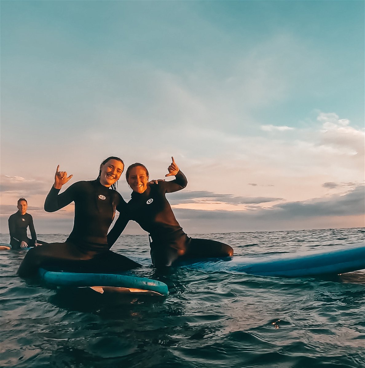 Female travellers on surfboards in australia 