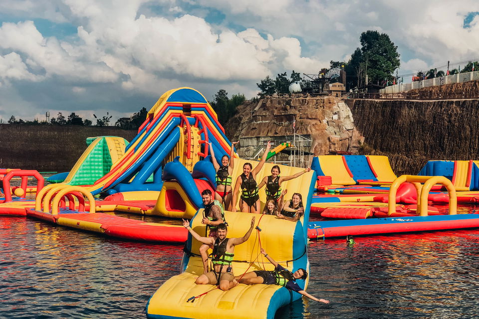 Group of travellers on inflatable in Grand Canyon waterpark in Thailand