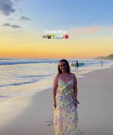 Costa Rica with emoji combo. Traveller standing in front of orange sunset on the beach in Costa Rica