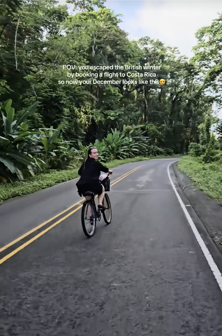 Traveller cycling down the street in Costa Rica. 