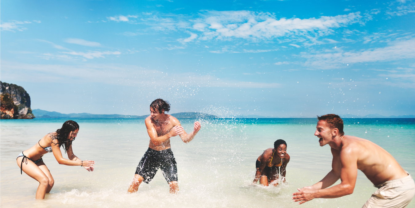 people playing near the beach in the ocean in the maldives