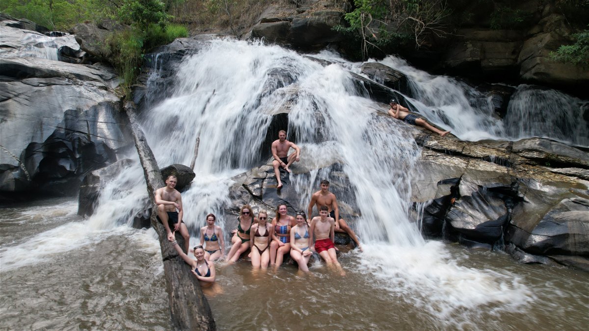Group at a waterfall in Chiang Mai, Thailand