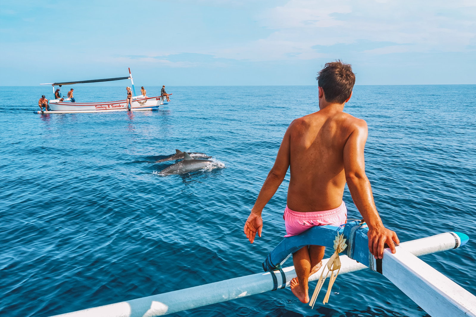 Traveller watching dolphines in lovina Bali
