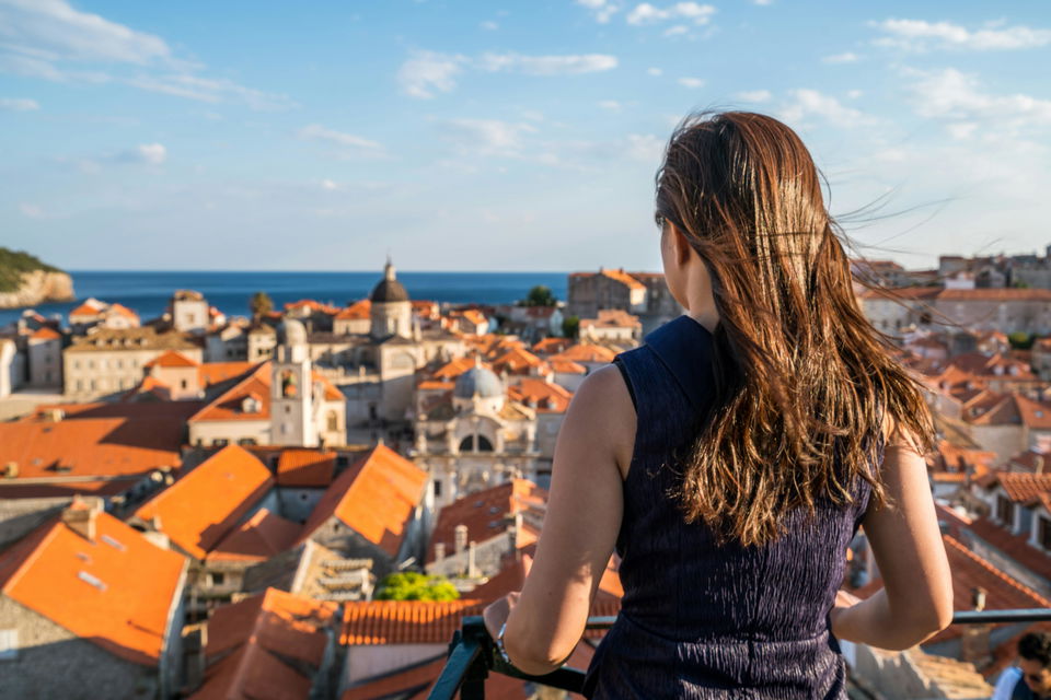 Woman looking over View of Dubrovnik in Croatia on group tour